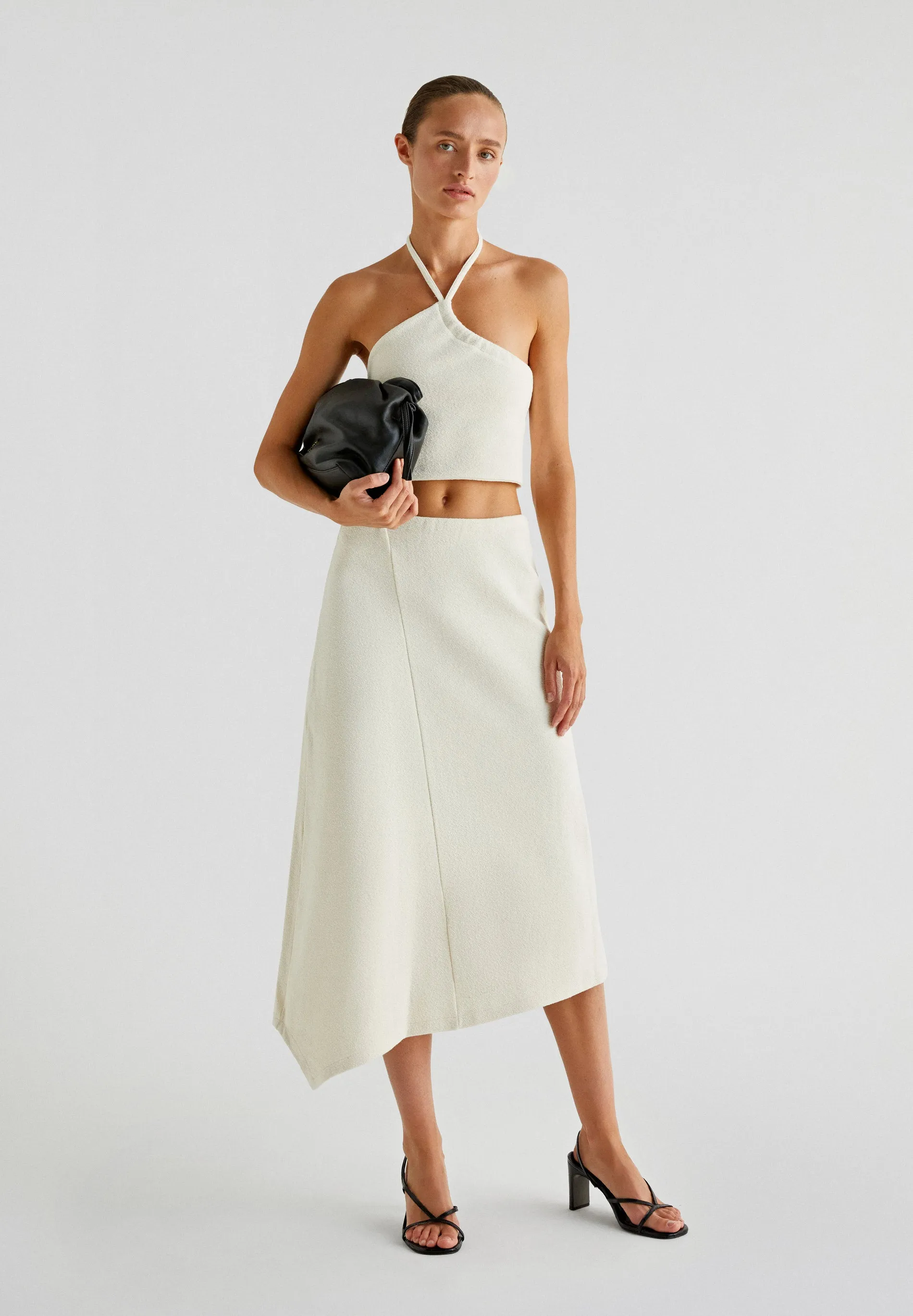 ASYMMETRIC KNIT MIDI SKIRT