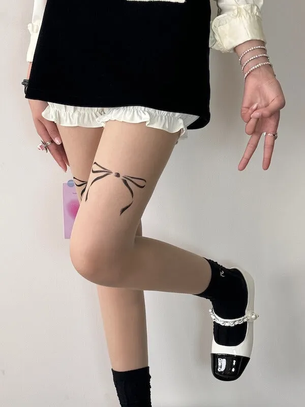 Doll bow tattoo tights